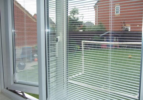 Open uPVC window looking into back garden